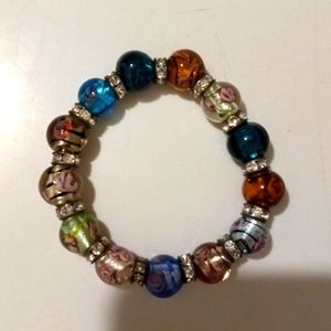Beautiful handmade beaded bracelet with flowers inside and rhinestone dividers